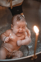 infant baptism and immersion in the baptismal font, Orthodox Christian rituals for believers in the...