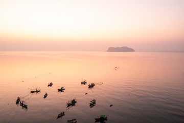 Sunrise view in the morning at Ban Hin Kop fishing village, near the pier to Koh Tao, Chumphon Province : Thailand.
