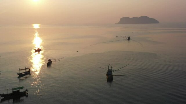 Sunrise view in the morning at Ban Hin Kop fishing village, near the pier to Koh Tao, Chumphon Province : Thailand.
