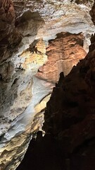 The cave's interior features magnificent limestone formations, intricate rock structures, and a...