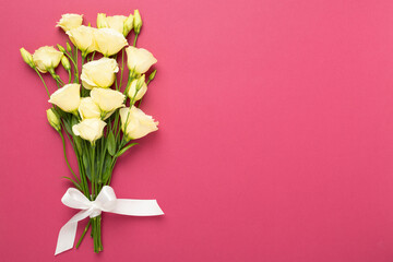 Beautiful bouquet with eustoma flowers on color background, top view