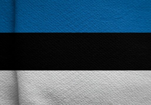 Estonian Flag Texture Background Blue, Black, and White Stripes, Fabric Detail for Patriotic Themes.
