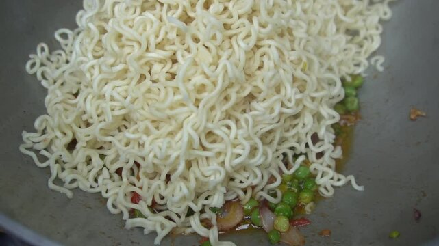 Boil water, add Maggi noodles and seasoning, cook for 2 minutes, stir well, and enjoy a quick, tasty meal.