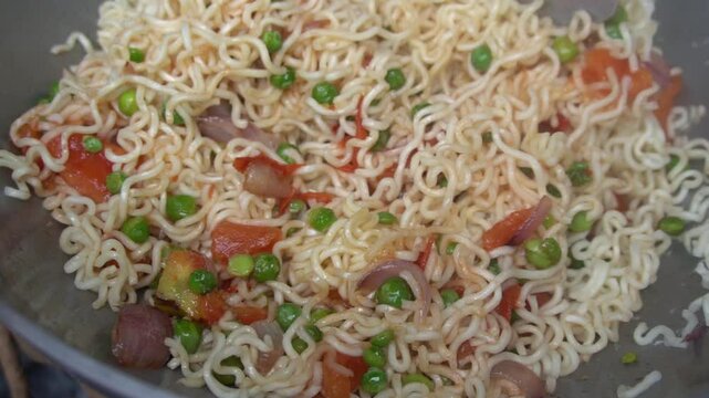 Boil water, add Maggi noodles and seasoning, cook for 2 minutes, stir well, and enjoy a quick, tasty meal.