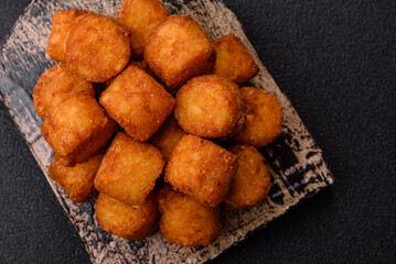 Cheese or potato croquettes, balls fried in breading with salt, spices