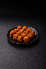 Cheese or potato croquettes, balls fried in breading with salt, spices