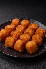 Cheese or potato croquettes, balls fried in breading with salt, spices