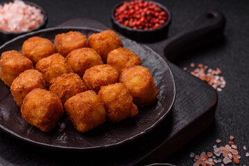 Cheese or potato croquettes, balls fried in breading with salt, spices