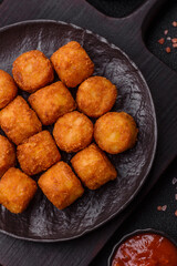 Cheese or potato croquettes, balls fried in breading with salt, spices