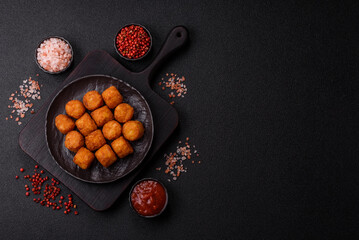 Cheese or potato croquettes, balls fried in breading with salt, spices