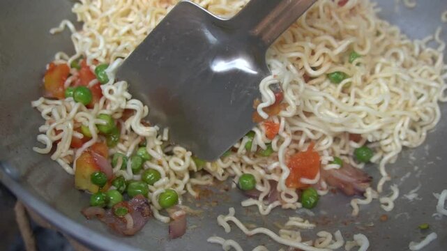 Boil water, add Maggi noodles and seasoning, cook for 2 minutes, stir well, and enjoy a quick, tasty meal.