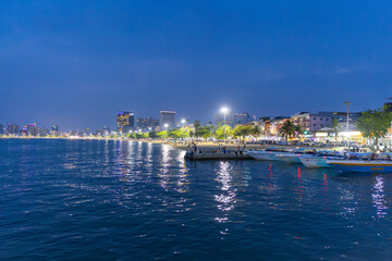 Fototapeta premium 2 April 2025 Pattaya Beach at Sunset with beautiful Orange purple and blue skies and boats in the sea people walking on the beach Pattaya Thailand