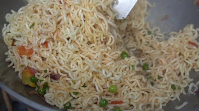 Boil water, add Maggi noodles and seasoning, cook for 2 minutes, stir well, and enjoy a quick, tasty meal.