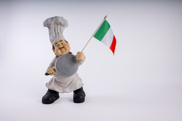 Chef figurine  with area for your message on a white background. Chef holding national flag of