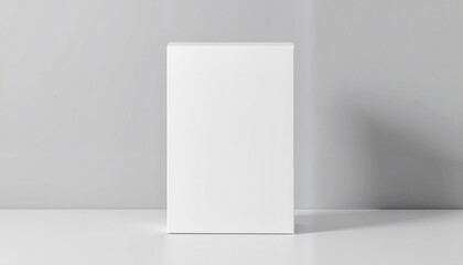Realistic white closed box mockup on soft gray backdrop, design presentation