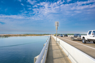 vehicle bridge with walking path at destin harbor