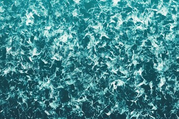 Obraz premium Ocean waves crash creating a mesmerizing pattern