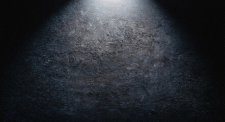 Spotlight illuminating dark grunge textured background for design