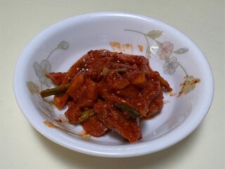 Spicy fermented skate dish served in a bowl