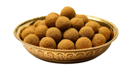 A golden bowl filled with many round laddu sweets stacked high in a decorative bowl on  on transparent background png