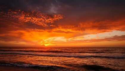 the sky is a beautiful orange color as the sun sets over the ocean