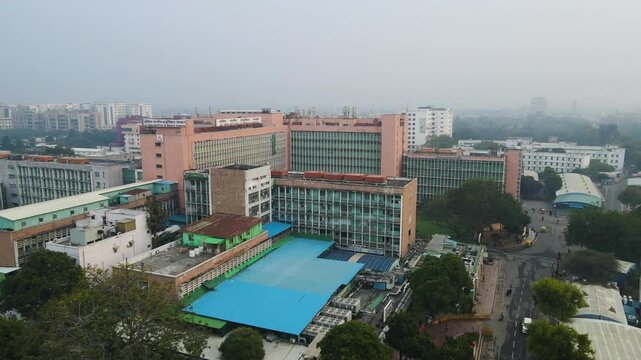 Aerial drone shot offering a panoramic view of AIIMS Delhi, revealing the institution's vast infrastructure amidst the urban landscape.