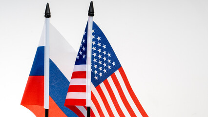 Fototapeta premium U.S. and Russian flag on a white background. Concept of the negotiation process.
