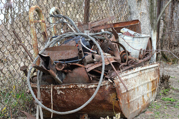 Pile of old scrap metal, rusty metal, prepared for recycling. Environmental pollution by waste....