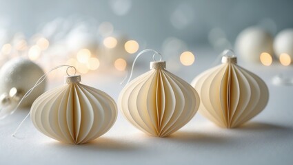 Flat lay of paper decorations, golden beige ornaments on a light backdrop, winter holiday celebration still life. Minimalist style image, elegant festive decor, top-down view, copy space.