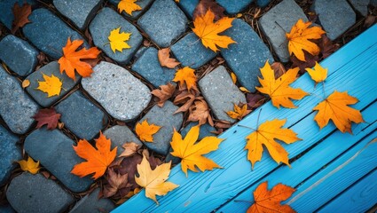 Autumn leaves scattered on a walkway and bench, highlighting vibrant colors and the tranquil beauty of seasonal transformation, representing the brief moments of nature.