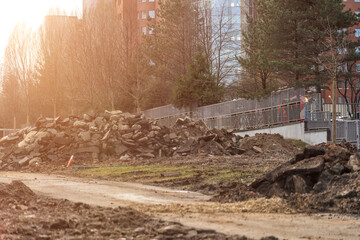 Post-construction Landscape: Mound of rubble and broken asphalt on a construction site.