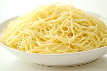 A close-up view of a heaping plate of perfectly cooked spaghetti, showcasing its texture and shine