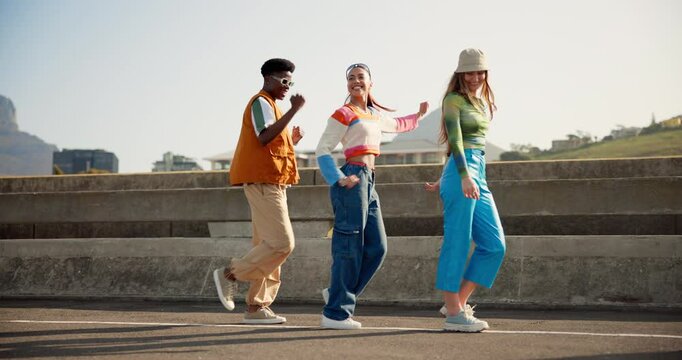 Friends, happy and people in city dance with trendy clothes, cool outfit and style in urban town. Fashion, diversity and men and women in streetwear outdoors with smile, confidence and movement