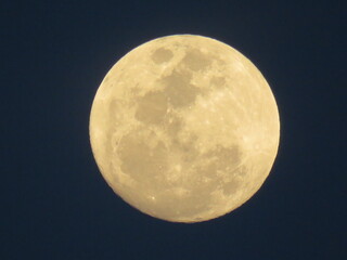 full moon over blue sky