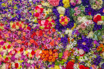 "Vibrant Natural Flower Wall Background – Colorful Floral Backdrop with Fresh Blooming Roses, Lilies, Daisies, Orchids, and Wildflowers for Wedding, Anniversary, birthday, office event backdrop"