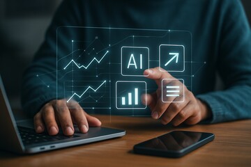 A person's hands interact with floating holographic icons above a laptop and smartphone, symbolizing AI, data processing, and digital connectivity in a futuristic workspace with glowing interface elem