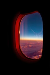 Airplane Window View of Clouds and Sky at Golden Sunset