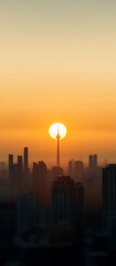 Fototapeta premium Urban Sunset: A cityscape silhouette at dawn with a tower piercing the setting sun, creating a striking skyline. Golden hour glow over city buildings.