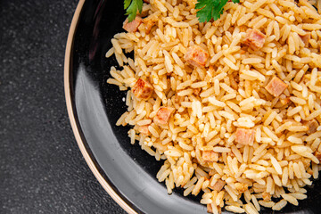 Rice meat ham main course fresh delicious gourmet food background on the table rustic food top view...