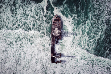 Aerial top view on the shipwreck in the Atlantic ocean on Skeleton Coast near Swakopmund in...