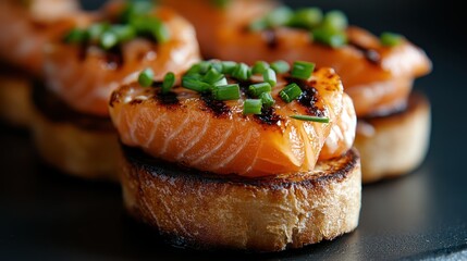 Close-up of beautifully plated gourmet salmon on toasted bread, garnished with fresh chives, showcasing a delicious appetizer perfect for food enthusiasts and gatherings.