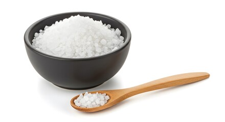 Bowl full of coarse white crystals with a wooden spoon resting to the side.  Shot in studio. Neutral color scheme. Minimal style. 