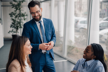 Business team discussing strategy in modern office environment