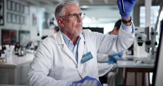 Blood, sample and science with man in laboratory for research, innovation or medical analysis. DNA, examination and test tube with mature scientist in healthcare for clinical trial with breakthrough