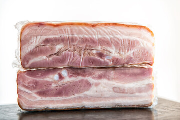 Montenegro local bacon vacuum packed made of red meat pork called Slanina with texture of lard fat macro closeup
