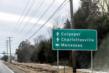 Road highway 29 south in northern Virginia with signpost directions to Manassas, Culpeper and Charlottesville car point of view