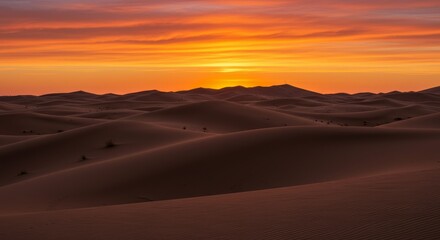 Fototapeta premium Desert Sunrise Glow - Amber and red dunes bathed in the warm glow of sunrise, symbolizing new beginnings, warmth, adventure, serenity, and vastness