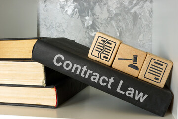 Contract law book on a shelf. Business agreements.