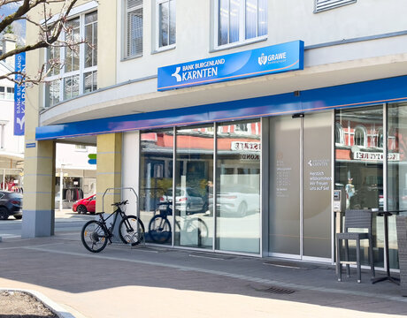 Grawe bank branch exterior with bicycle and reflections on glass windows