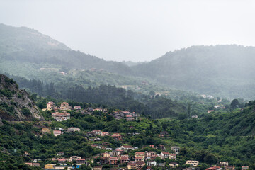 Kotor Skurda canyon cliff mountains by old fort fortress trail hike in rain with cityscape skyline of old town Montenegro coastal city in summer